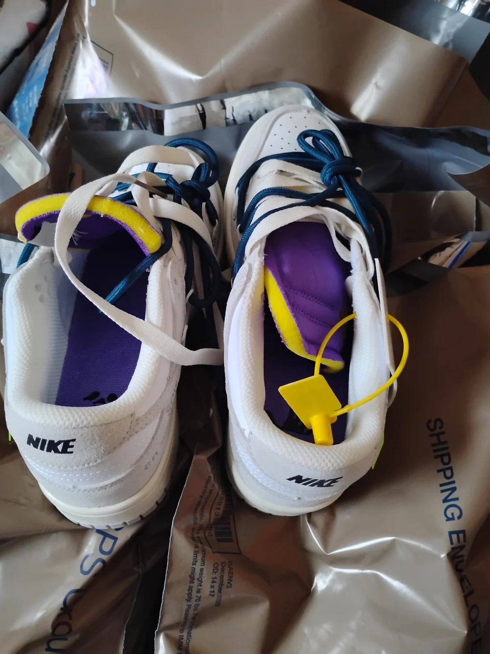 Nike Men’s White Sneakers with Purple and Yellow Accents